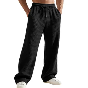 Herrenhose mit Waffelstruktur, weitem Bein und elastischem Kordelzug in Schwarz