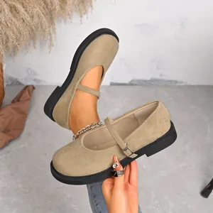 Khaki suede Mary Jane flats with round toe and delicate buckle strap.