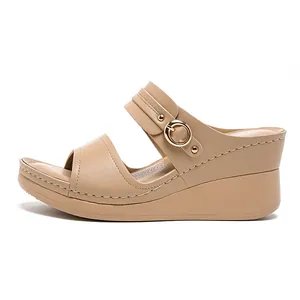 Comfortable women's beige wedge platform sandals with decorative gold buckle accents