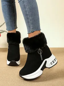 Detailed view of black women's faux fur platform wedge snow boots with side zipper