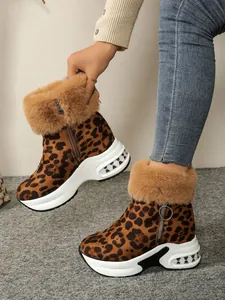 Side view detail of leopard print wedge snow boots with plush faux fur trim and platform sole