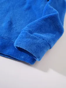 Macro close-up detail of soft blue plush fleece fabric texture on hoodie sleeve
