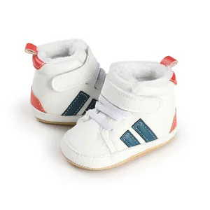 Close-up view of warm white fleece-lined baby walking shoes with blue stripe design