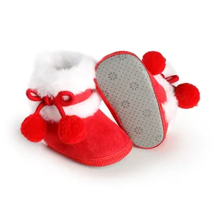 Detail view of red baby princess boots with soft non-slip soles and fur trim
