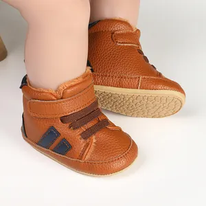Detailed close-up of brown plush lined baby walking shoes with textured leather