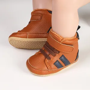 Detailed view of brown faux leather baby walking shoes featuring a warm fleece lining