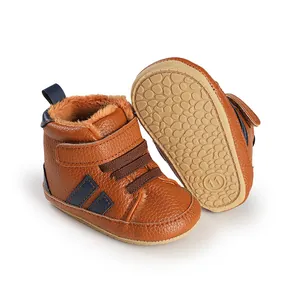 Detail view of brown fleece-lined baby winter walking shoes with non-slip rubber sole