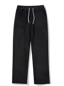 Close-up detail view of high-quality black fleece sweatpants with white adjustable drawstrings