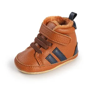 Close-up of warm brown fleece-lined infant walking shoes featuring a secure velcro strap.