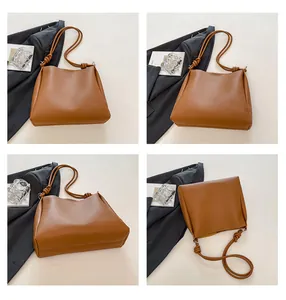 Collage of four angles showing a large brown retro leather tote bag with knotted straps