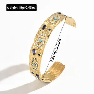 Detailed view of golden stainless steel evil eye cuff bracelet with size and weight info