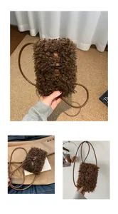 Detailed view of brown fuzzy plush crossbody phone bag with toggle closure
