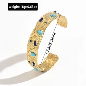 Close-up of gold stainless steel cuff bracelet showing 6.2cm diameter and 18g weight