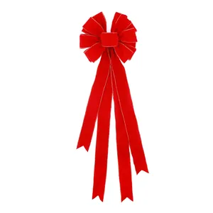 Large red velvet Christmas bow with silver wired edges for holiday tree decoration.