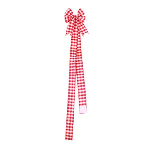 Large red and white gingham Christmas bow with long ribbons and wired edges.