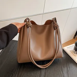 Vintage large capacity brown faux leather tote bag featuring unique knotted shoulder straps