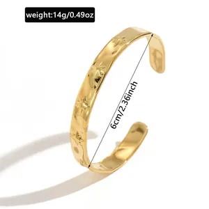 Detailed view of gold stainless steel star cuff bracelet with 6cm diameter and 14g weight