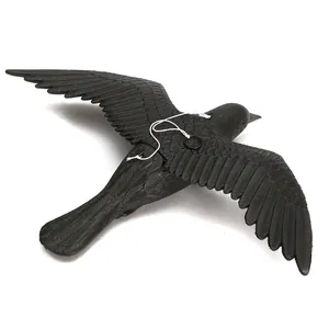 Detailed top view of a lifelike black crow decoy with spread wings and hanging loop.