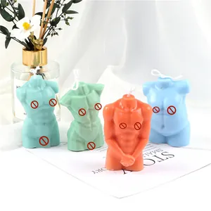 Detailed macro view of male torso shaped aromatherapy candles in multiple colors