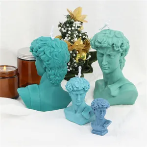 Artistic David bust aromatherapy candles in various sizes and teal blue color tones