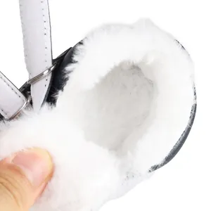 Detailed macro view showing thick white faux fur lining inside warm winter baby shoes