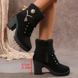 Close-up showing the 8.5cm heel height on black chunky boots with knit collar accents