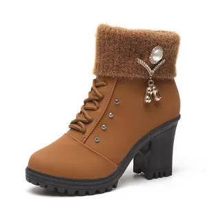 Stylish brown chunky high heel ankle boots with rhinestone knit collar and charm detail