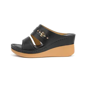 Comfortable women's black wedge sandals with stylish gold geometric studs decoration.