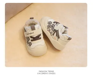 Macro view of cream fleece-lined toddler walking shoes with cute panda detail