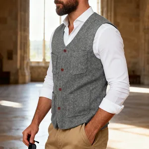 Detail of a grey wool blend men's vest featuring four front pockets and red buttons.