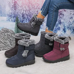 Close-up of waterproof women's snow boots showing various colors and cozy faux fur lining detail.