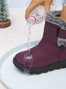 Waterproof test on purple winter snow boots with warm faux fur lining