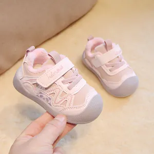 Pink plush-lined toddler winter walking shoes with cute panda design and soft sole