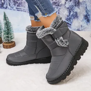 Detailed side view of grey waterproof winter snow boots with warm faux fur lining