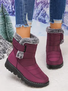 Detail view of purple waterproof women's snow boots with plush lining and velcro
