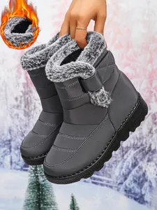 Warm grey women's snow boots with waterproof upper and faux fur lining detail