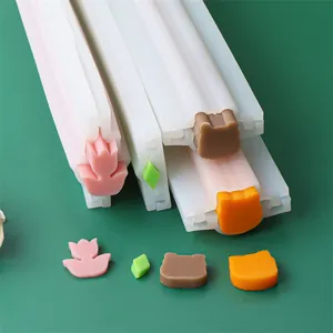 Detail of silicone tube molds showing tulip, cat, and bear shapes for DIY soap.
