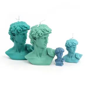 Artistic David bust scented candles in various sizes and teal shades on white background