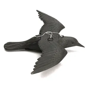 Realistic black crow decoy with spreading wings for garden decoration or hunting lure.