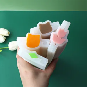 Macro detail of animal and flower shaped silicone tube molds for DIY soap and cakes