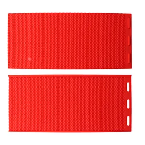 Detailed view of red silicone honeycomb mold for DIY beeswax foundation sheets