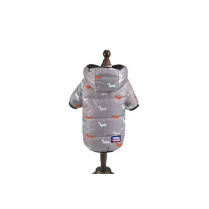 Detailed view of the gray pet winter coat featuring a colorful dachshund pattern and back logo