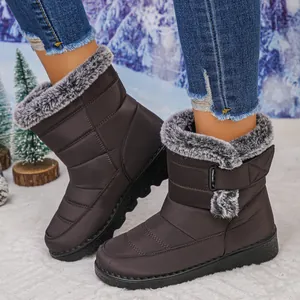 Side detail view of brown waterproof women's snow boots with cozy faux fur lining