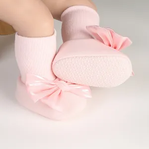 Detail of pink baby bowknot anti-slip floor socks with dotted sole for infants