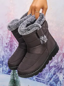 Detail of warm waterproof snow boots for women with grey faux fur trim