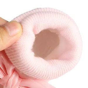 Close-up view of pink fleece-lined baby shoe interior showing thick warm material