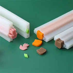 Close-up of DIY silicone tube molds for soap and mousse showing various animal shapes