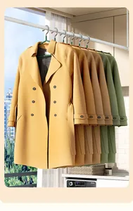 Detailed view of heavy-duty plastic-coated hangers supporting thick winter coats