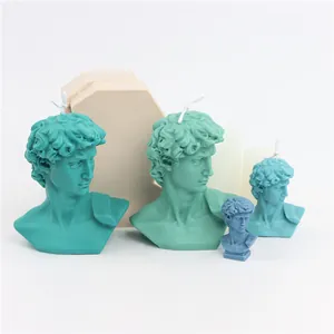 Various sizes of artistic David bust candles alongside their matching DIY silicone molds