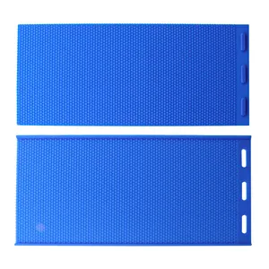 Detail of blue silicone beehive foundation mold with hexagonal honeycomb texture